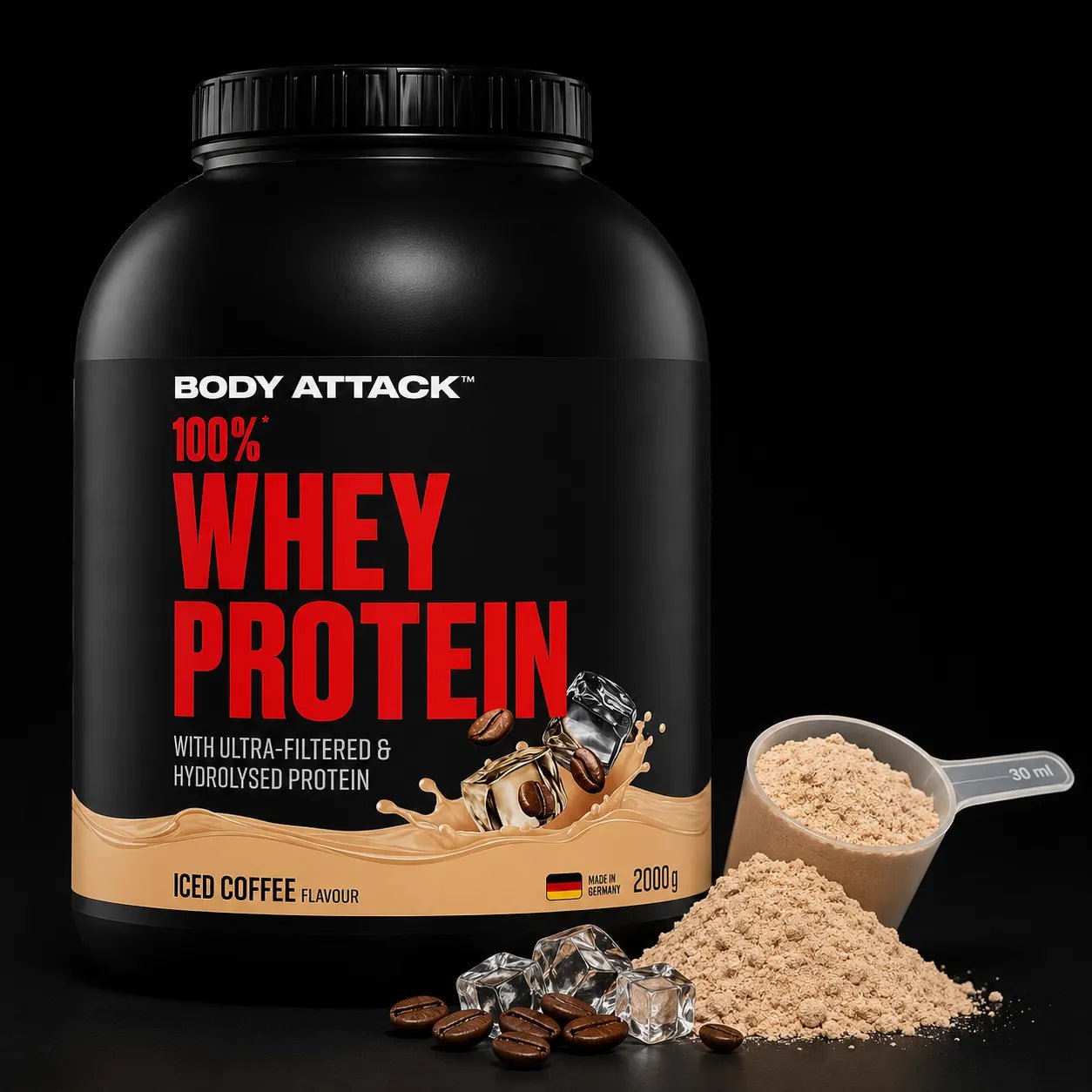 A large black tub of Body Attack 100% Whey Protein in Iced Coffee Flavour, shown alongside a scoop and pile of the light beige powder on a black background.
