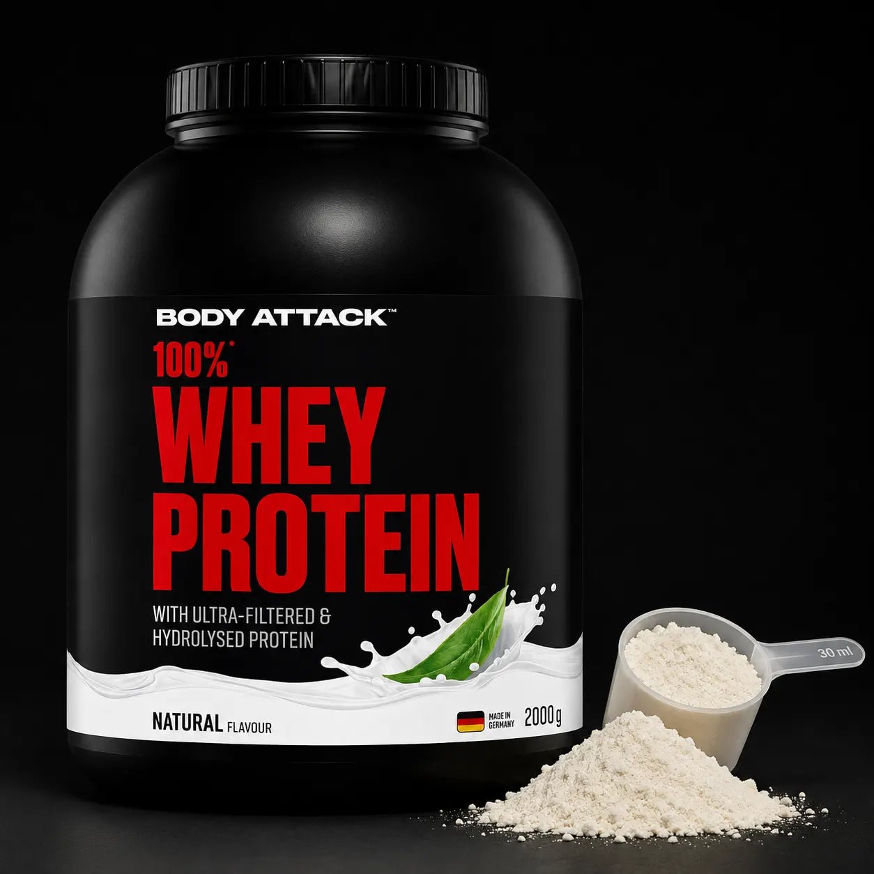 A large black tub of Body Attack 100% Whey Protein powder with red and white text, shown on a black background with a scoop and pile of white powder in front.
