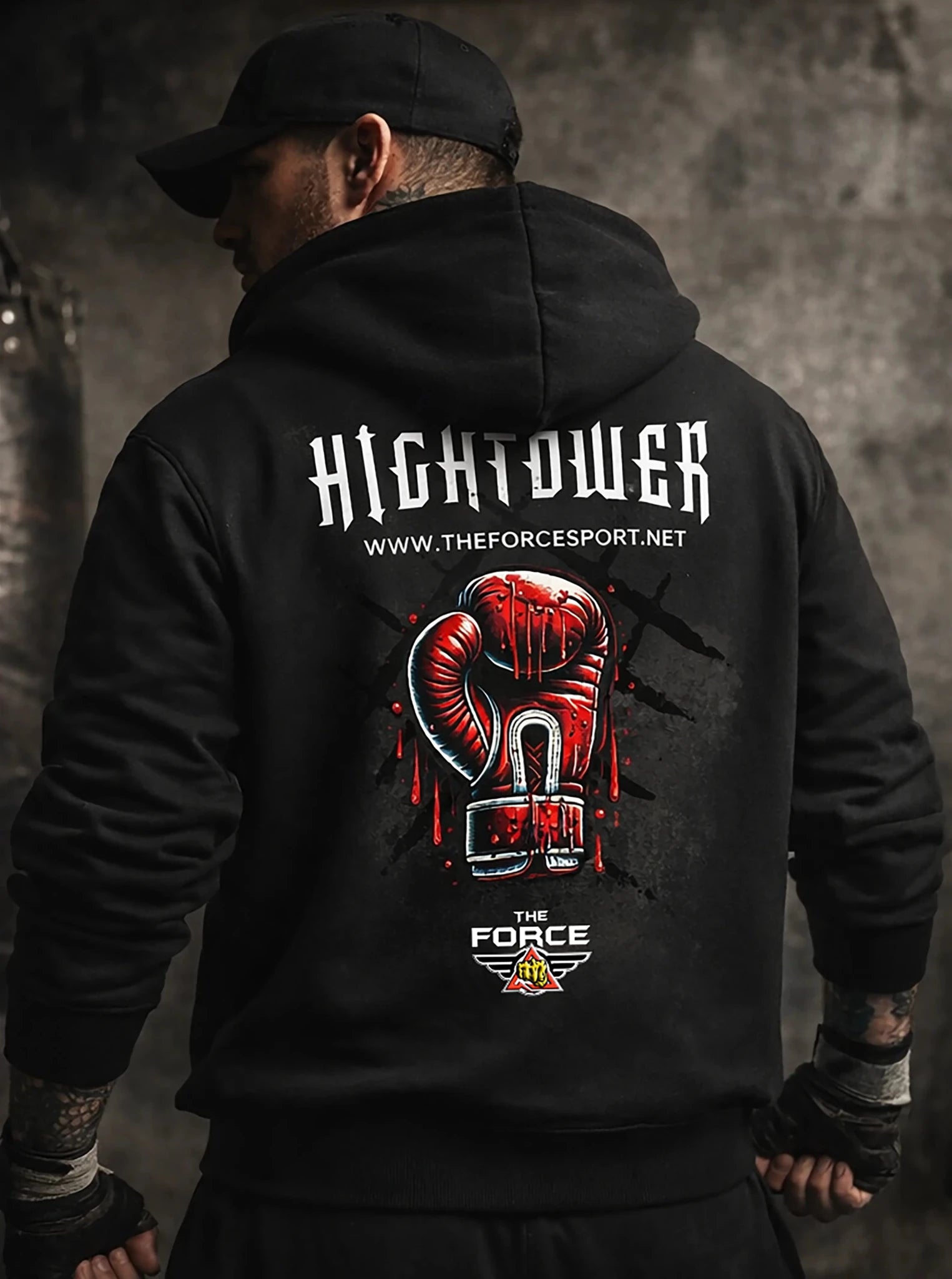 Person wearing a black hoodie with 'Hightower' branding and graphic design on the back.