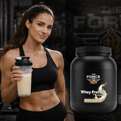 Woman holding a protein shake next to a 'The Force' whey protein container.